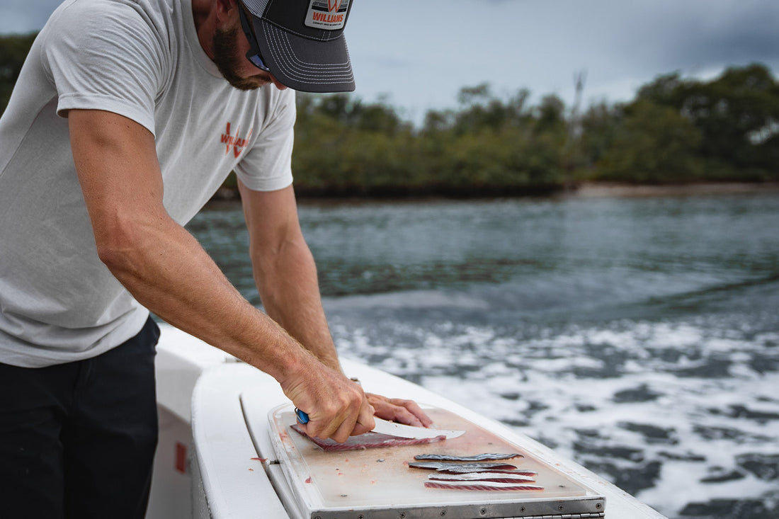 Man on a boat using the best fillet knife from Williams Knife