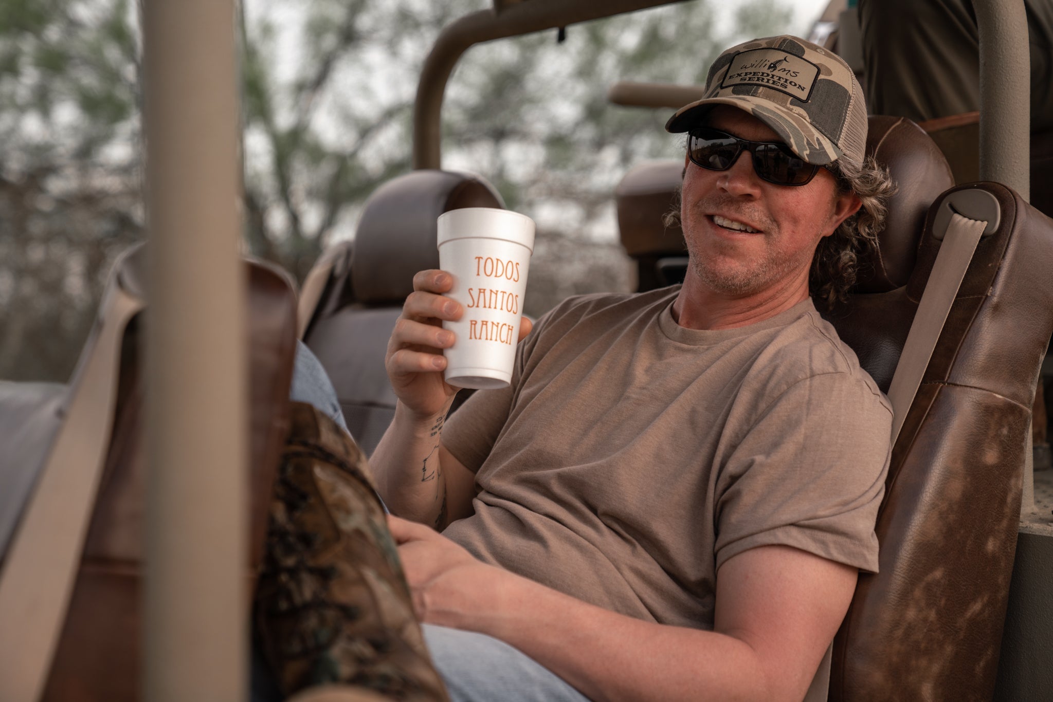 Chris Williams holding a Wild Sour drink